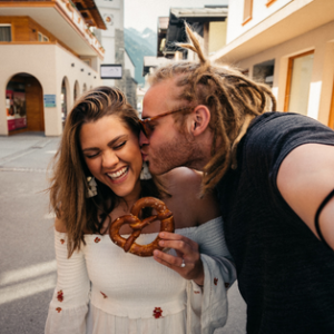 A guy kissing a girl